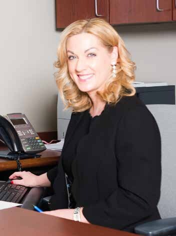 Shelley McLeod sitting at desk